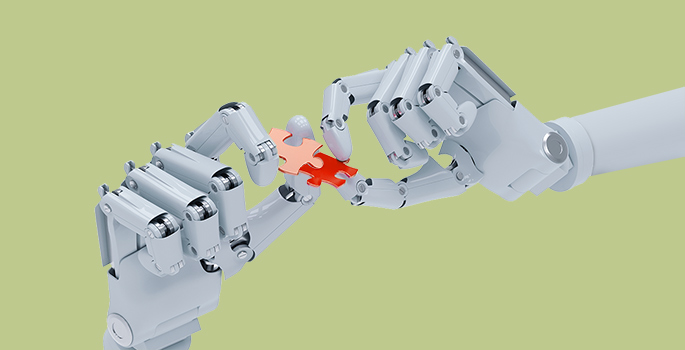 Robotic hands holding puzzle pieces